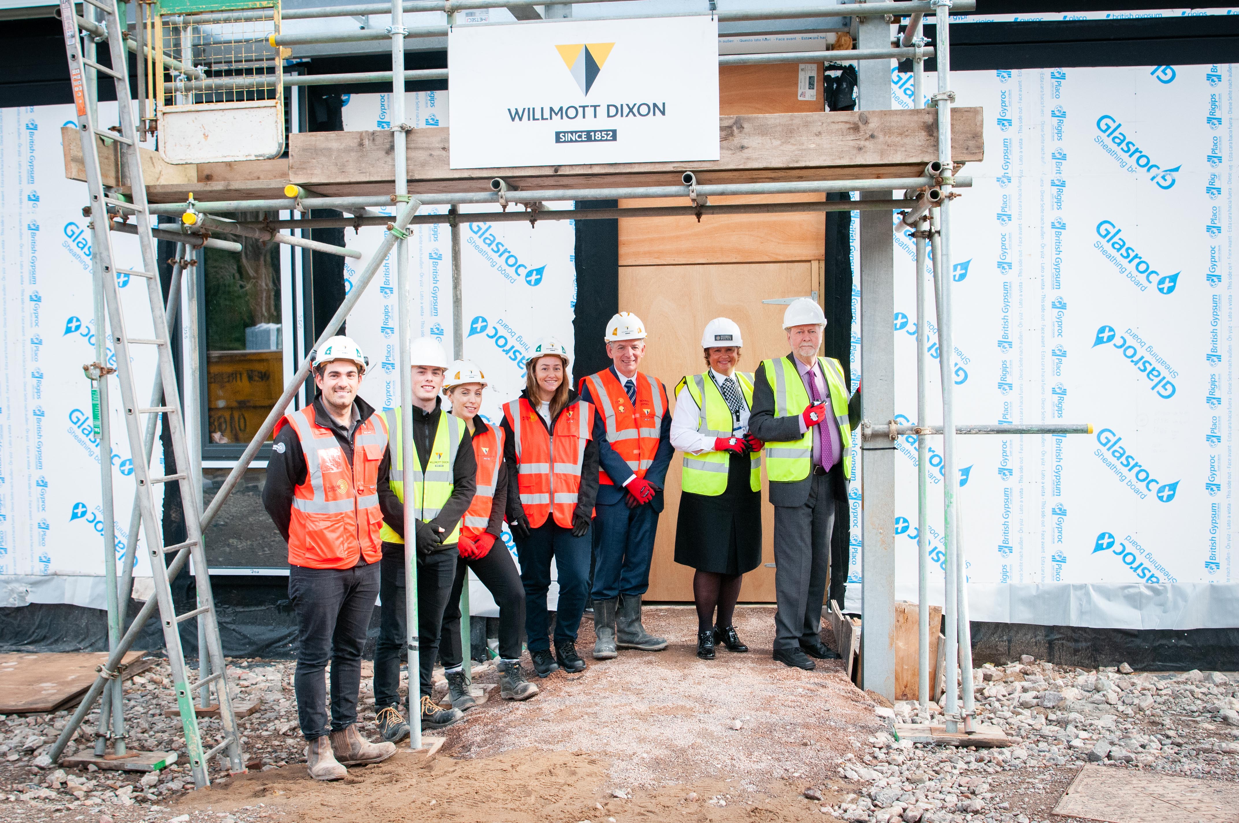 PCC, chief constable and partners standing in front of new police building 