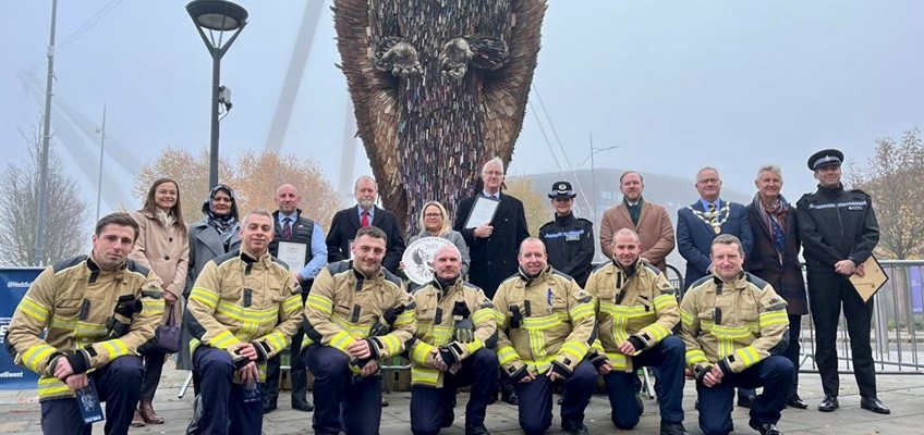 Group in front of knife angel