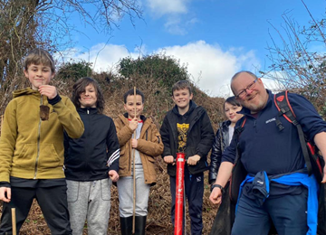 Members of the Youf Gang planting trees