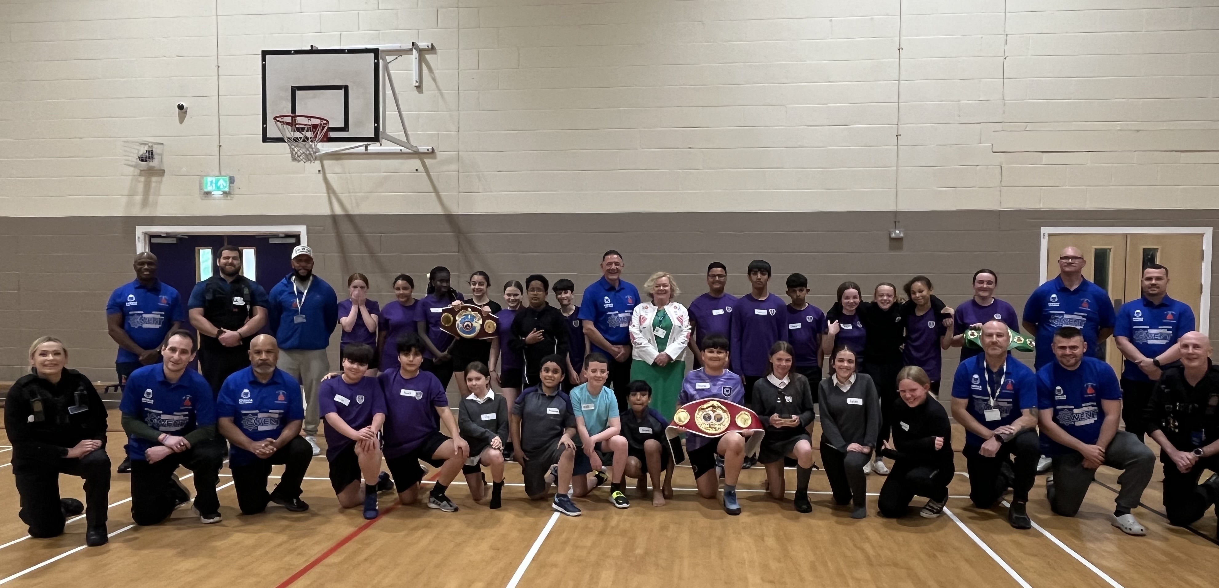 Commissioner Jane Mudd with coaches from St Joes boxing Club and pupils from John Frost School