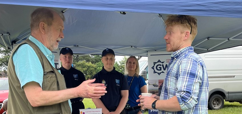 Jeff Cuthbert talking to resident