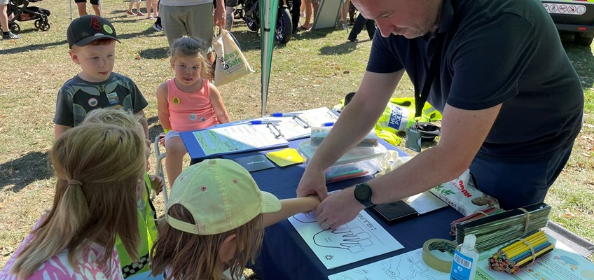 Member of the OPCC finger printing children