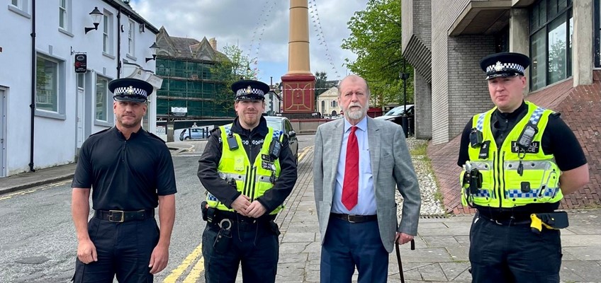 Jeff Cuthbert with police officers in Tredegar