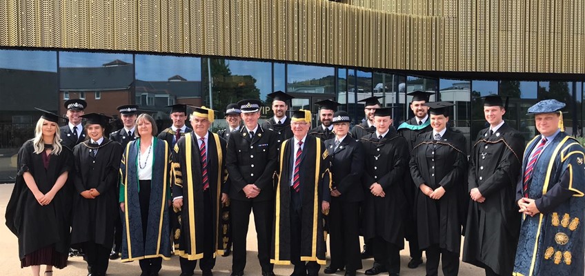 Gwent Police officers and representatives in graduation gowns