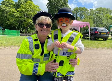 Lady and girl dressed in police uniform