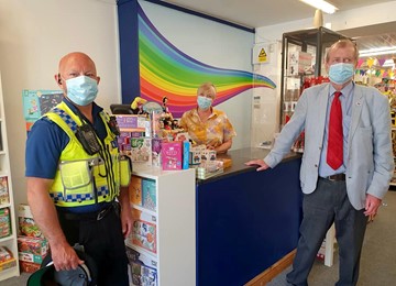 Jeff Cuthbert, a police officer and members of the public