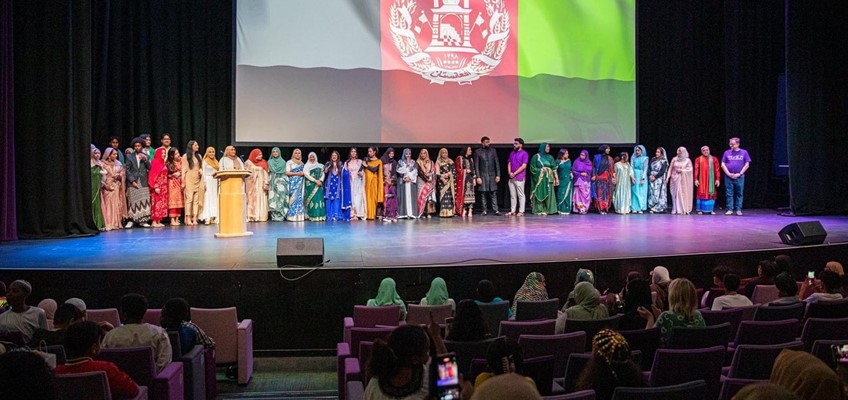 children gathered on stage