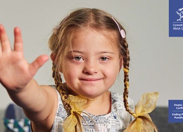 little girl with arm stretched out