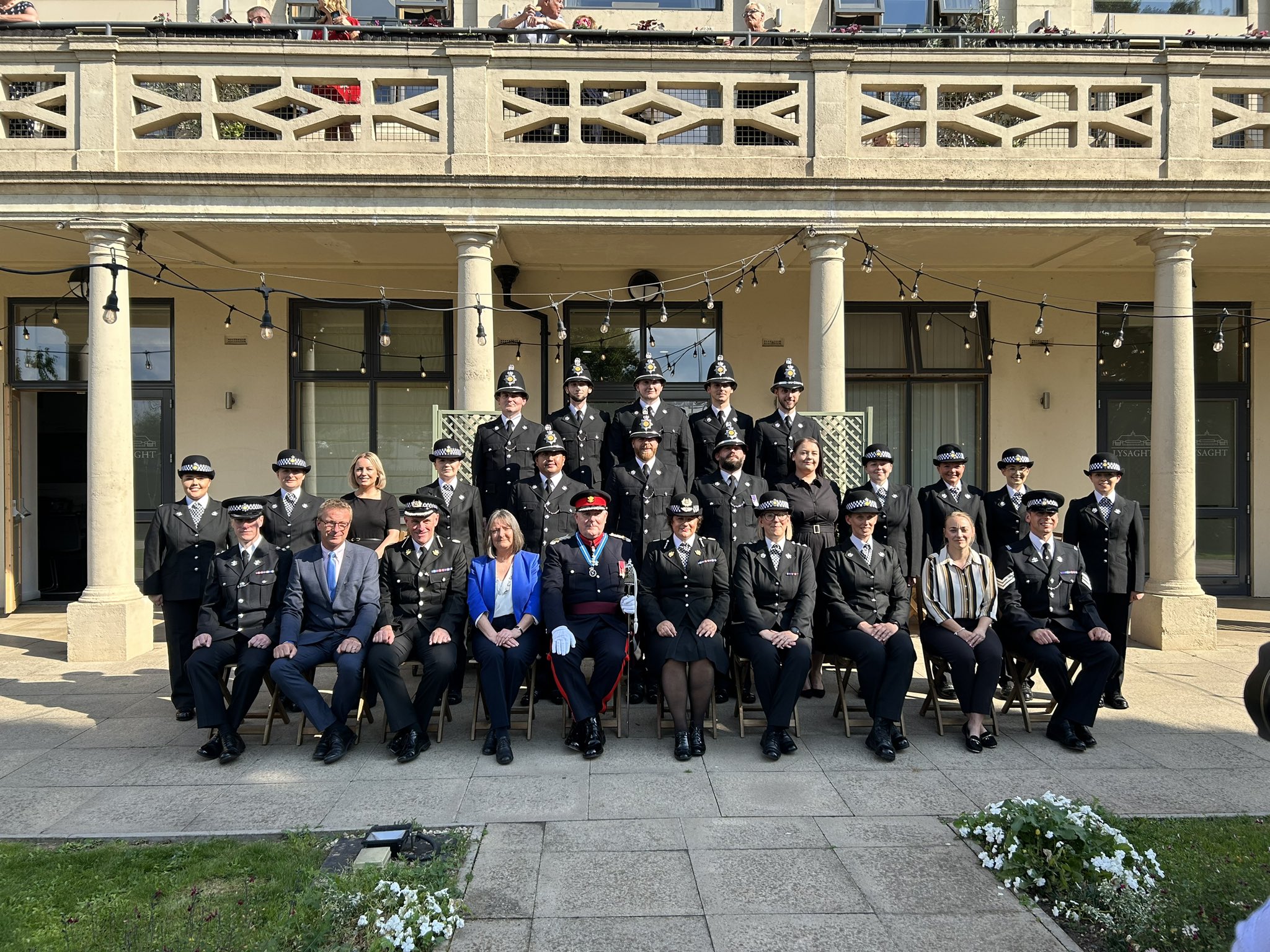 Police officers and dignitaries posed formally for photo