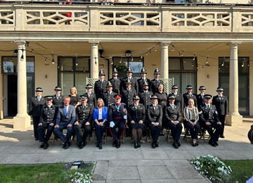 Police officers and dignitaries posed formally for photo