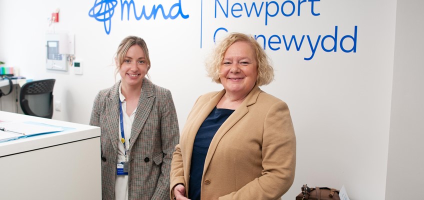 Jane Mudd with an officer from Newport Mind