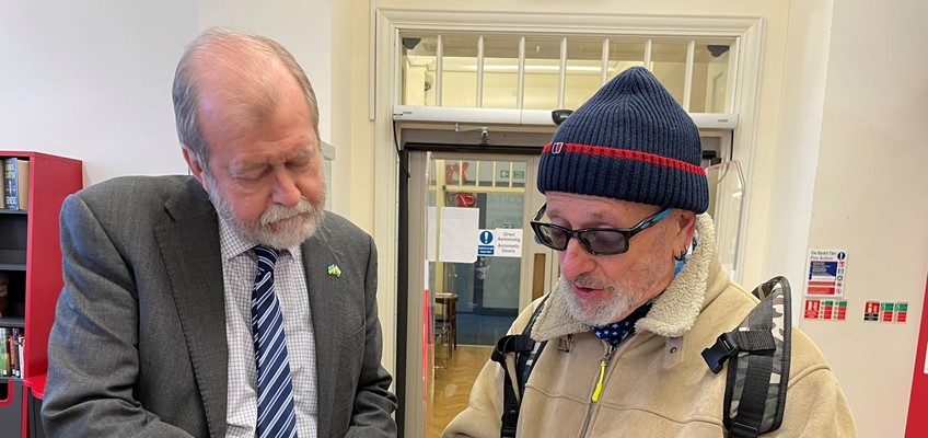 Jeff Cuthbert talking to resident