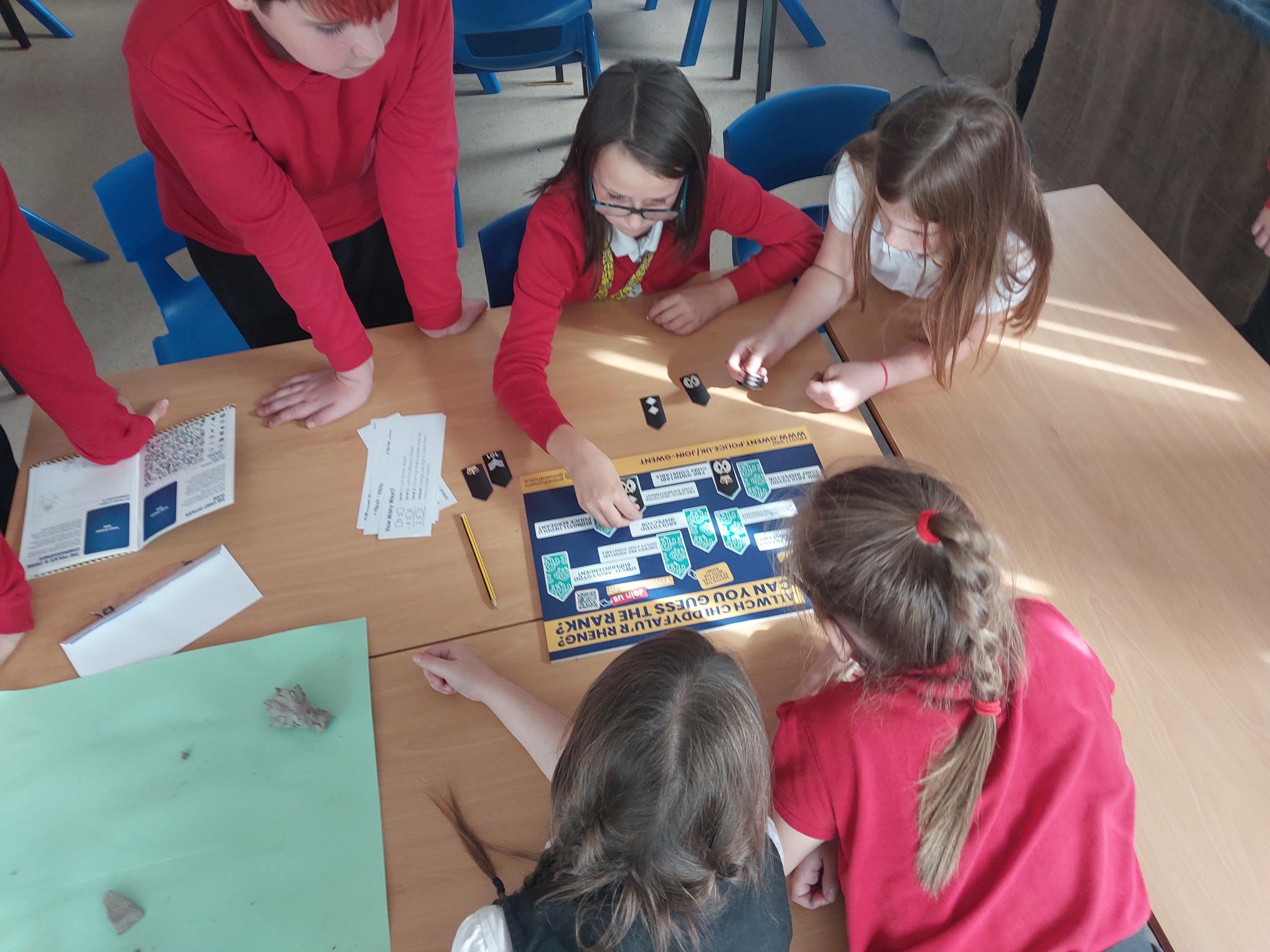 Children looking at document 