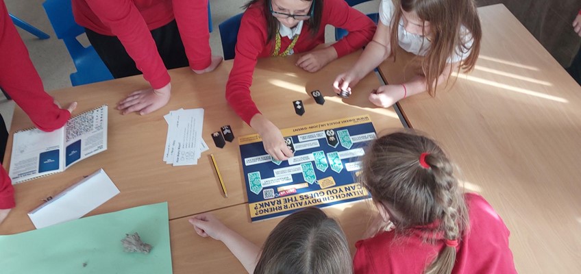 Children looking at document 